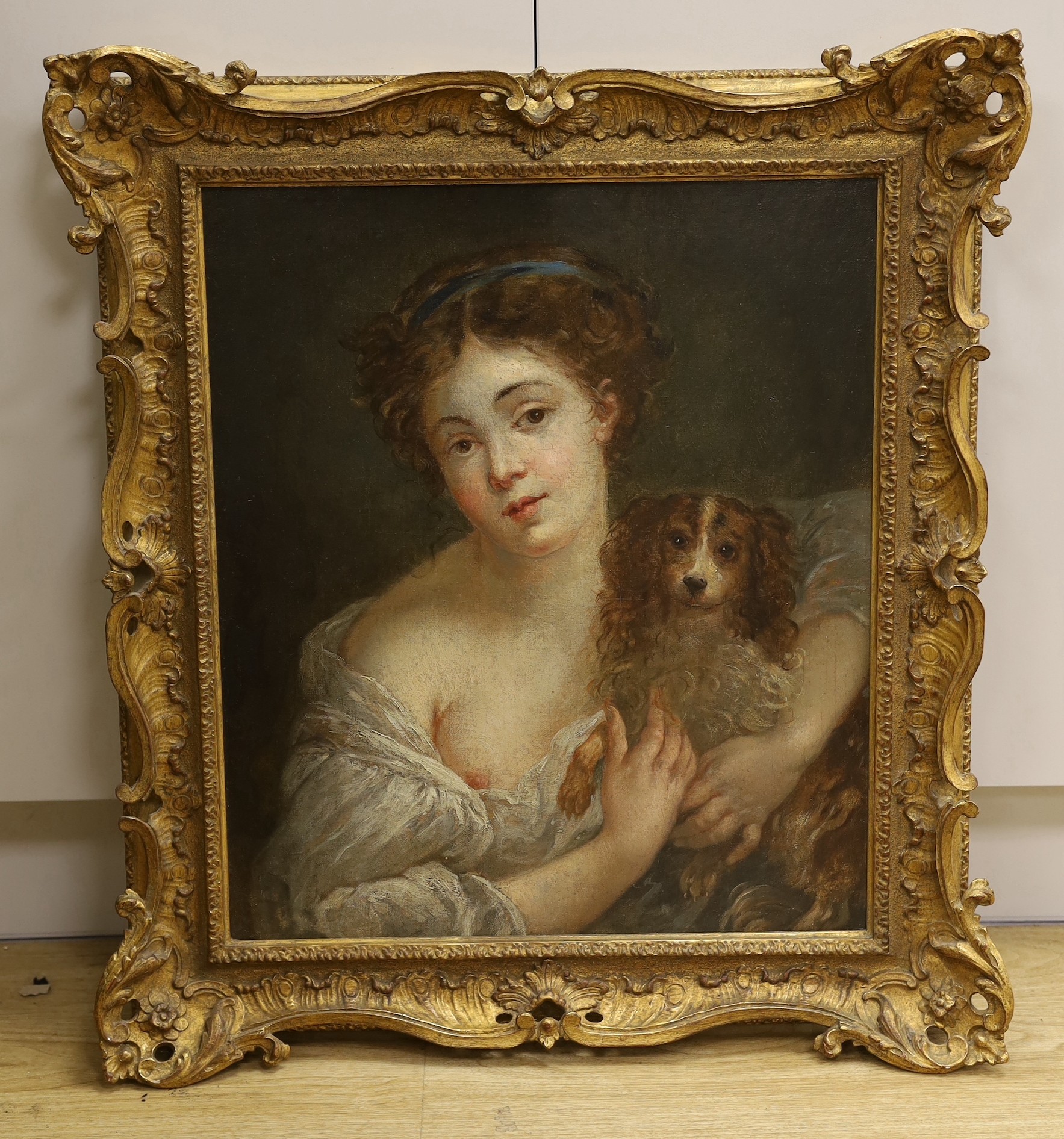 Follower of Jean-Baptiste Grueze (French, 1724/5-1805), oil on canvas, Portrait of a young woman with a spaniel, 52 x 44cm